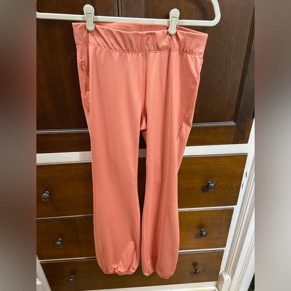 Free People Movement flare leggings with elastic bottoms in peach, size small. - Picture 1 of 3